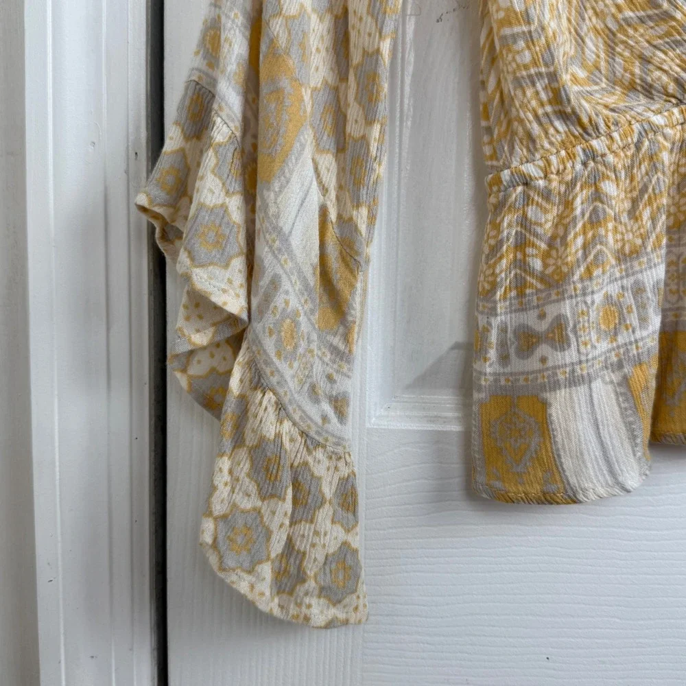 Free People Smocked Peplum‎ Blouse S Yellow Boho Ruffle Sleeve Wrap Top